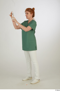 Photos Daya Jones Nurse Pose 1 preparing a jab standing…